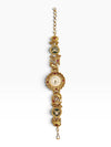 An ornate vintage gold watch chain featuring multiple decorative links with red and green enamel details, a central round dial, and a dangling teardrop charm, shown against a plain white background.